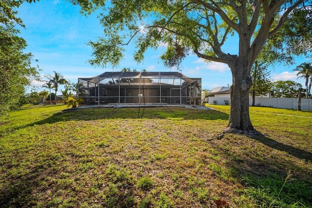 rear view of property with glass enclosure