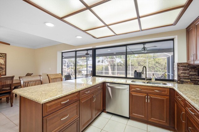 925 Eagle Ln, Apollo Beach, FL 33572 - kitchen with stainless steel dishwasher, a sink, light tile patterned floors, decorative backsplash, and recessed lighting