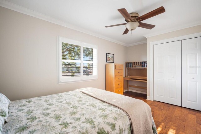 925 Eagle Ln, Apollo Beach, FL 33572 - bedroom with wood finished floors, ornamental molding, a closet, and ceiling fan