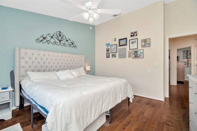 bedroom with dark wood-style flooring, baseboards, and a ceiling fan