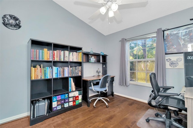 office area featuring a ceiling fan, vaulted ceiling, wood finished floors, and baseboards
