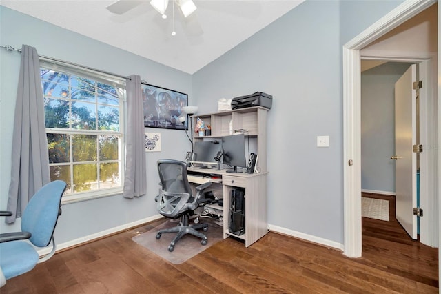 office area featuring wood finished floors, vaulted ceiling, plenty of natural light, baseboards, and a ceiling fan