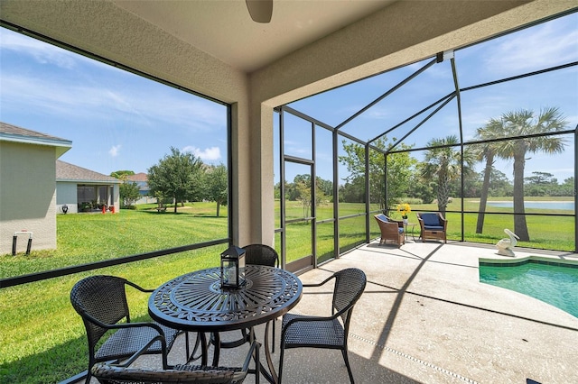 764 W Bayshore Dr, Tarpon Springs, FL 34689 - sunroom featuring a water view and a ceiling fan