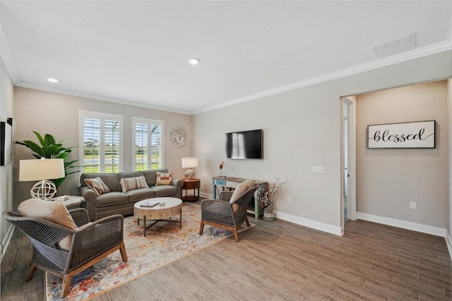 764 W Bayshore Dr, Tarpon Springs, FL 34689 - living room with crown molding, baseboards, wood finished floors, and recessed lighting