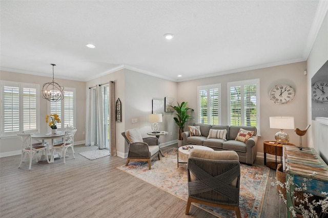 764 W Bayshore Dr, Tarpon Springs, FL 34689 - living area featuring a chandelier, wood finished floors, baseboards, recessed lighting, and crown molding