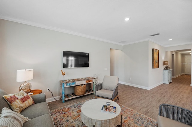 764 W Bayshore Dr, Tarpon Springs, FL 34689 - living room featuring baseboards, wood finished floors, crown molding, and recessed lighting
