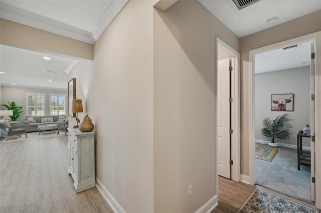 764 W Bayshore Dr, Tarpon Springs, FL 34689 - corridor with light wood-style floors, ornamental molding, baseboards, and recessed lighting