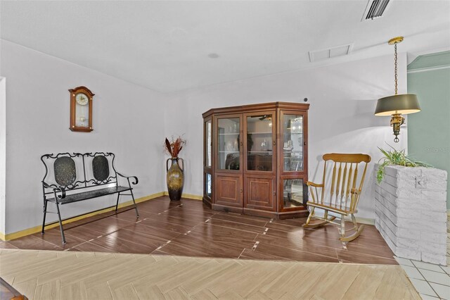 6801 Pinellas Point Dr S, Saint Petersburg, FL 33712 - sitting room featuring baseboards and wood finished floors