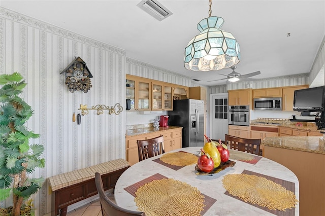 6801 Pinellas Point Dr S, Saint Petersburg, FL 33712 - dining space with wallpapered walls and ceiling fan