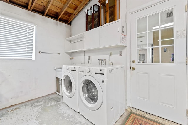 6801 Pinellas Point Dr S, Saint Petersburg, FL 33712 - laundry area with wood ceiling and washer and clothes dryer