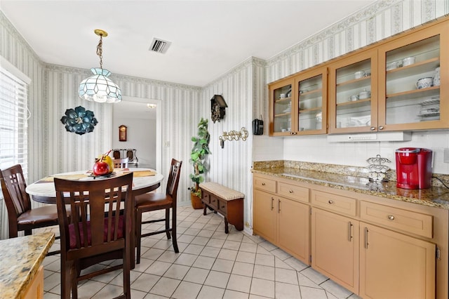 6801 Pinellas Point Dr S, Saint Petersburg, FL 33712 - dining area featuring wallpapered walls and light tile patterned floors