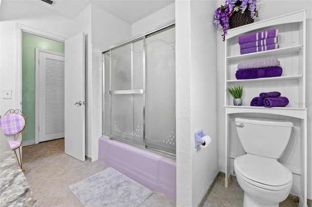 6801 Pinellas Point Dr S, Saint Petersburg, FL 33712 - full bath featuring combined bath / shower with glass door, toilet, and baseboards