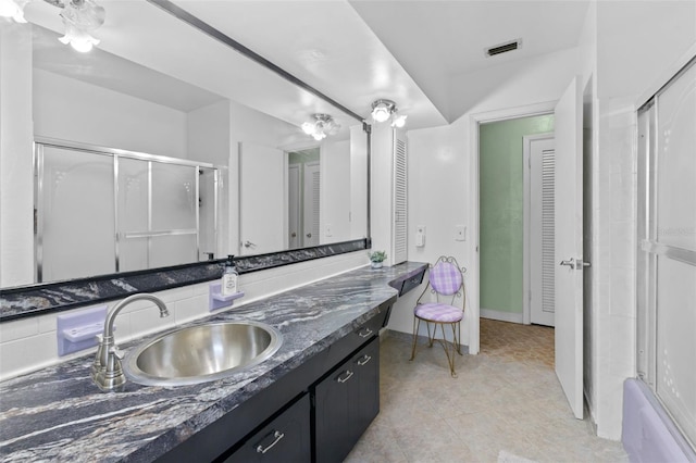 6801 Pinellas Point Dr S, Saint Petersburg, FL 33712 - full bathroom featuring a closet, vanity, baseboards, and tile patterned flooring