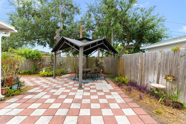 6801 Pinellas Point Dr S, Saint Petersburg, FL 33712 - fenced backyard featuring a gazebo, a patio, and outdoor dining space