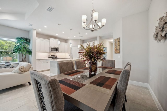 12817 Cobalt Ter, Bradenton, FL 34211 - dining room featuring a chandelier, baseboards, recessed lighting, and light tile patterned floors