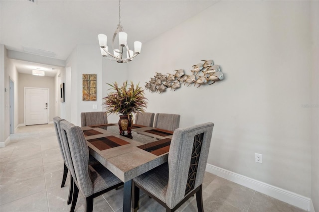 12817 Cobalt Ter, Bradenton, FL 34211 - dining room featuring a chandelier, baseboards, and light tile patterned floors
