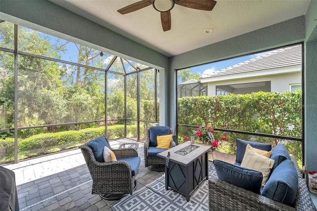 12817 Cobalt Ter, Bradenton, FL 34211 - sunroom / solarium featuring ceiling fan and an outdoor living space with a fire pit