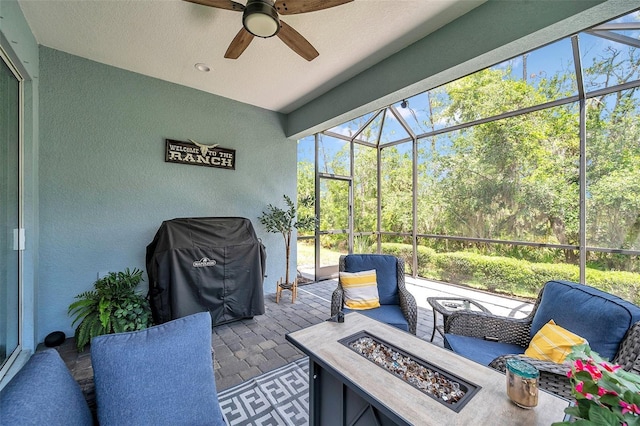 12817 Cobalt Ter, Bradenton, FL 34211 - sunroom with an outdoor fire pit, ceiling fan, and healthy amount of natural light