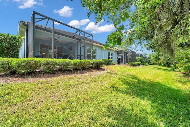 12817 Cobalt Ter, Bradenton, FL 34211 - view of grassy yard with a lanai