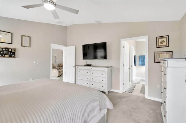 bedroom with lofted ceiling, light colored carpet, baseboards, and ceiling fan