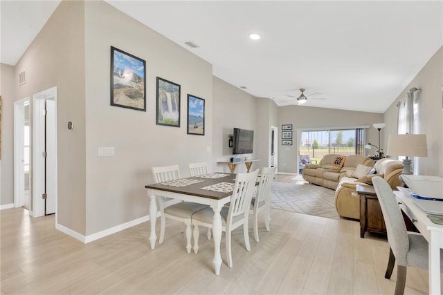 dining area featuring a ceiling fan, vaulted ceiling, light wood-style flooring, baseboards, and recessed lighting