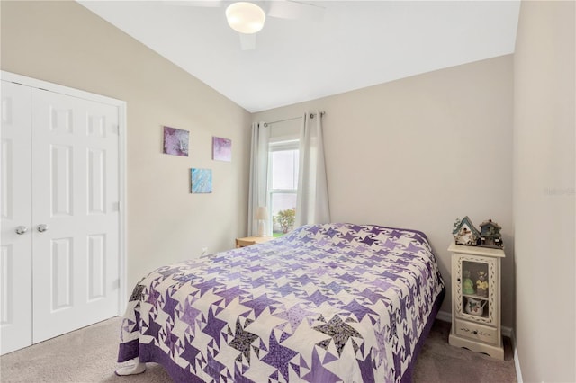 bedroom with carpet floors, vaulted ceiling, a closet, and ceiling fan