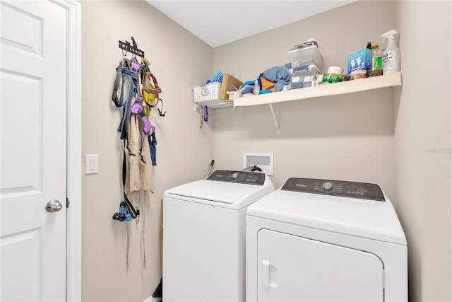 laundry room with washing machine and clothes dryer