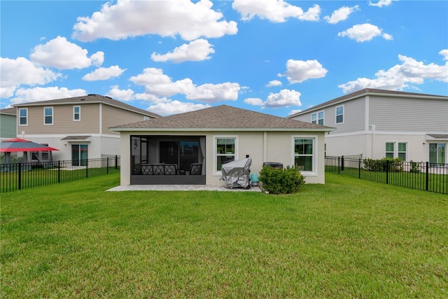 back of property with a sunroom, stucco siding, and roof with shingles