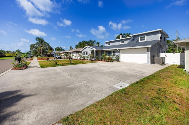 6536 115th Ln, Seminole, FL 33772 - view of front of home featuring driveway, cooling unit, and a gate