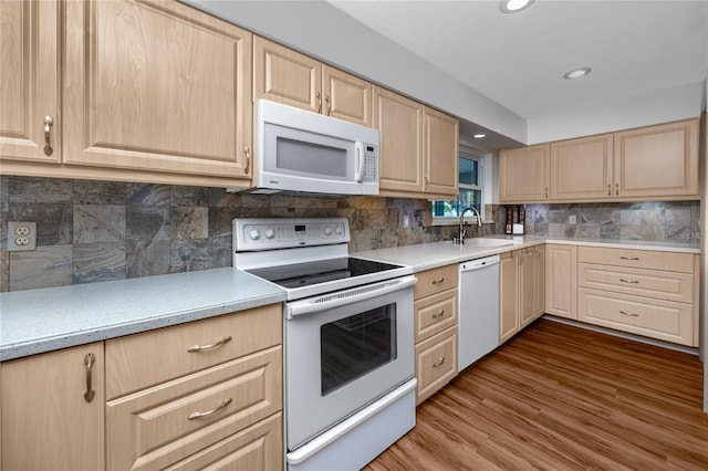 6536 115th Ln, Seminole, FL 33772 - kitchen featuring white appliances, light brown cabinetry, a sink, light countertops, and recessed lighting