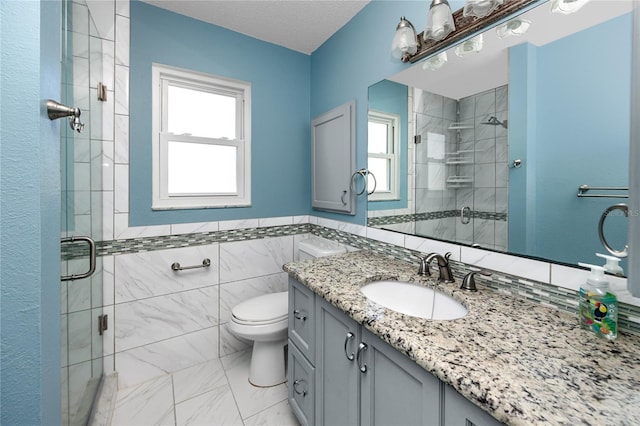 6536 115th Ln, Seminole, FL 33772 - bathroom featuring a shower stall, healthy amount of natural light, toilet, tile walls, and a wainscoted wall