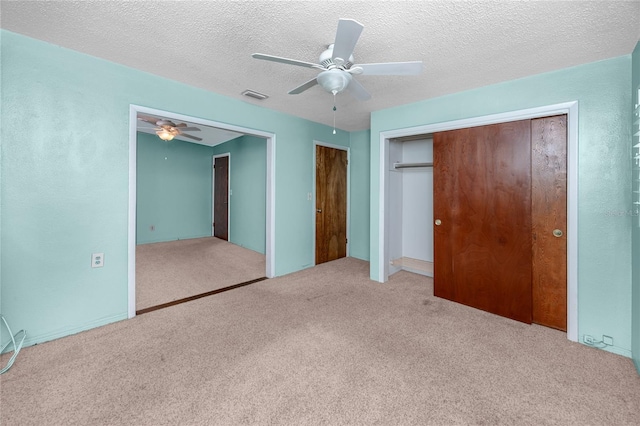 6536 115th Ln, Seminole, FL 33772 - unfurnished bedroom featuring carpet flooring, ceiling fan, and a textured ceiling