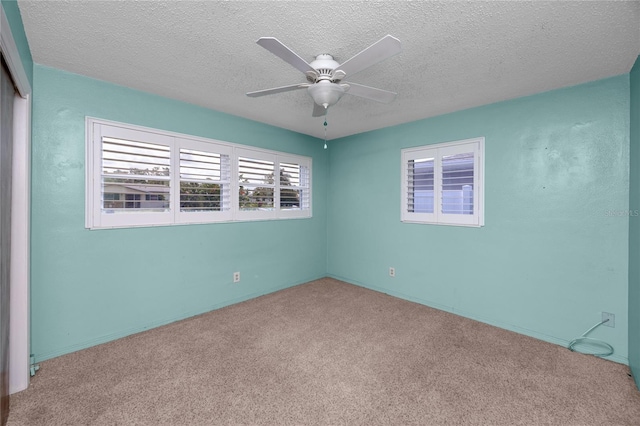 6536 115th Ln, Seminole, FL 33772 - empty room featuring carpet floors, ceiling fan, and a textured ceiling