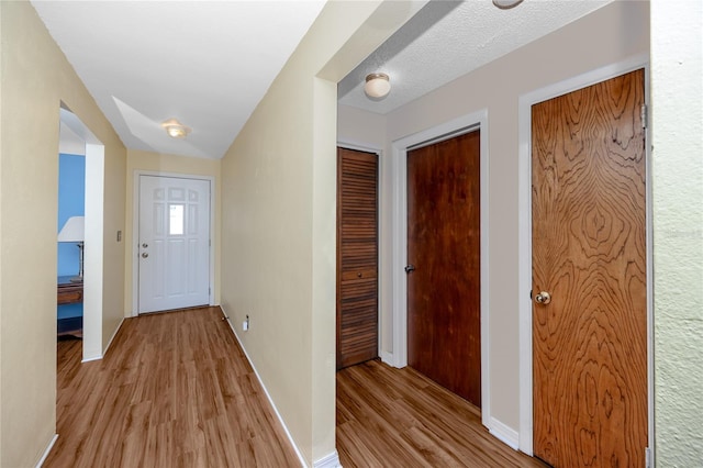 6536 115th Ln, Seminole, FL 33772 - entryway featuring light wood finished floors and baseboards