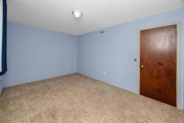 6536 115th Ln, Seminole, FL 33772 - carpeted spare room with baseboards and a textured ceiling