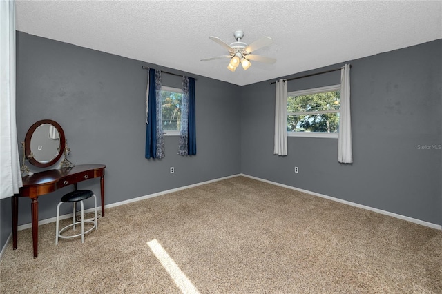 6536 115th Ln, Seminole, FL 33772 - carpeted empty room featuring a ceiling fan, a textured ceiling, and baseboards
