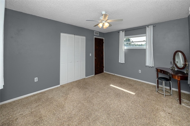 6536 115th Ln, Seminole, FL 33772 - carpeted bedroom featuring a textured ceiling, a closet, a ceiling fan, and baseboards