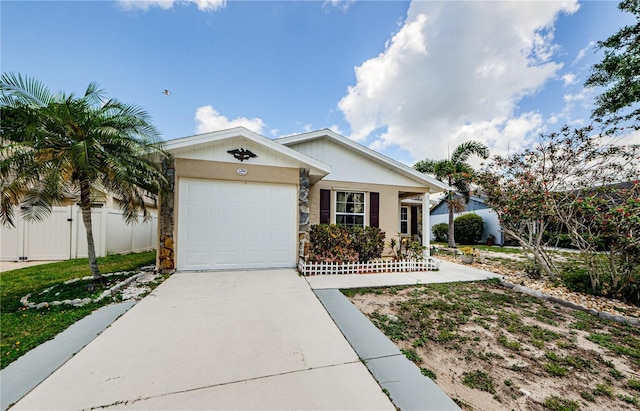 699 Merlins Ct, Tarpon Springs, FL 34689 - ranch-style house featuring driveway, an attached garage, and stucco siding