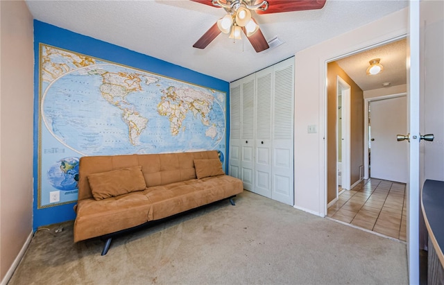 699 Merlins Ct, Tarpon Springs, FL 34689 - sitting room with carpet, ceiling fan, baseboards, and a textured ceiling