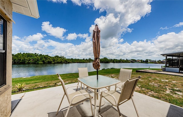 699 Merlins Ct, Tarpon Springs, FL 34689 - view of patio with a water view and outdoor dining space