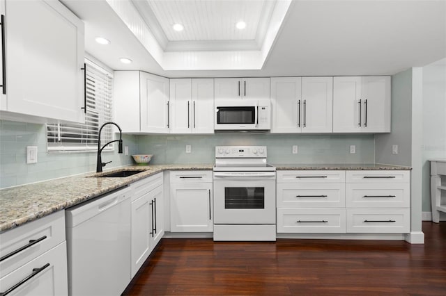 2033 Arbor Dr, Clearwater, FL 33760 - kitchen with white appliances, a tray ceiling, a sink, dark wood finished floors, and recessed lighting