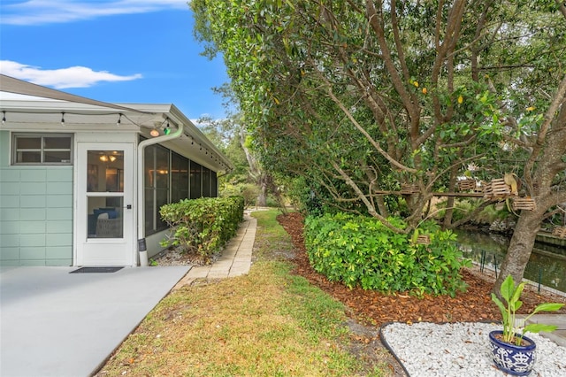 view of yard with a sunroom