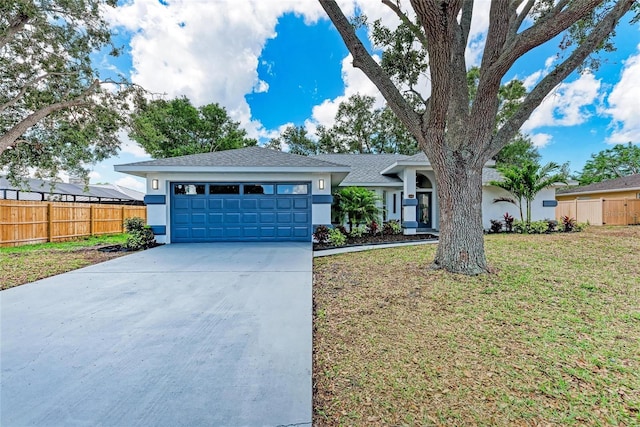 3330 46th Ter E, Bradenton, FL 34203 - view of front facade with stucco siding, concrete driveway, a garage, and roof with shingles