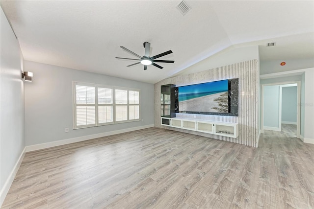 3330 46th Ter E, Bradenton, FL 34203 - unfurnished living room with vaulted ceiling, ceiling fan, wood finished floors, and baseboards