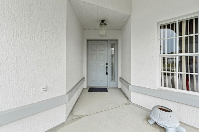 9188 Rhett Ln, Weeki Wachee, FL 34613 - view of exterior entry with stucco siding