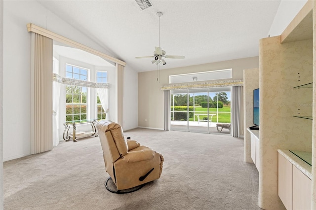 9188 Rhett Ln, Weeki Wachee, FL 34613 - unfurnished room featuring lofted ceiling, light carpet, plenty of natural light, and ceiling fan