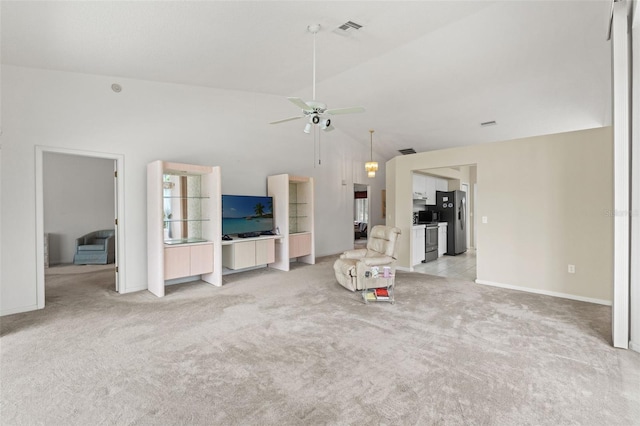 9188 Rhett Ln, Weeki Wachee, FL 34613 - unfurnished living room with light colored carpet, a ceiling fan, baseboards, and high vaulted ceiling