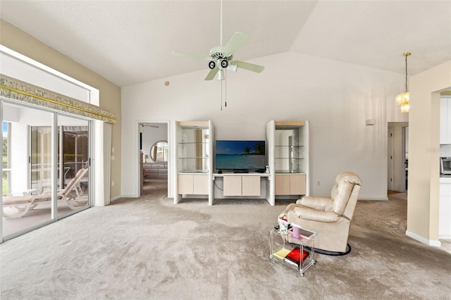 9188 Rhett Ln, Weeki Wachee, FL 34613 - unfurnished living room featuring carpet, a ceiling fan, and high vaulted ceiling