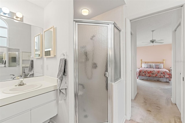 9188 Rhett Ln, Weeki Wachee, FL 34613 - ensuite bathroom featuring a shower stall, ceiling fan, and vanity