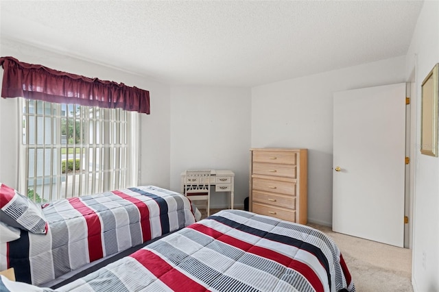 9188 Rhett Ln, Weeki Wachee, FL 34613 - carpeted bedroom featuring a textured ceiling